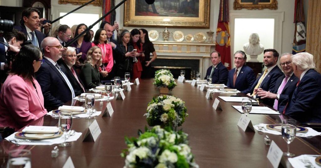 Photo of Trump told Rudd from across the table, 'I don't like you either.'