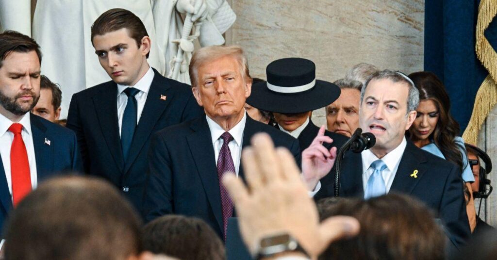 image of Barron Trump stands at 6 feet and 9 inches.