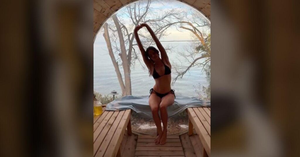 image of Nina Dobrev did some stretches before her sauna time.