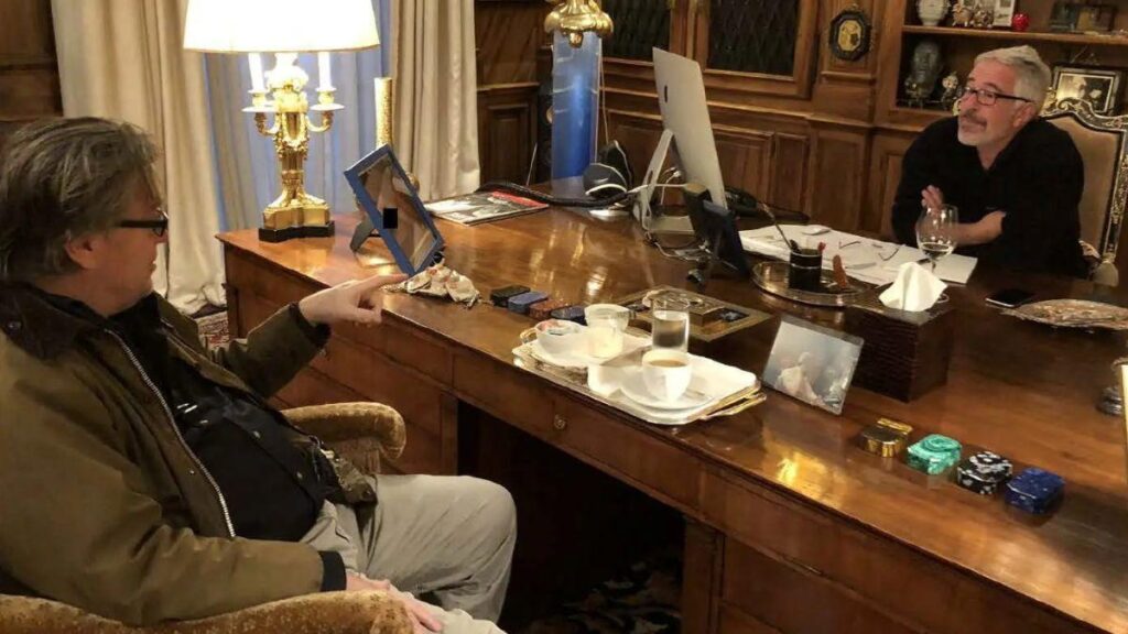 image of The right-wing media executive can be seen in conversation with the disgraced financier.