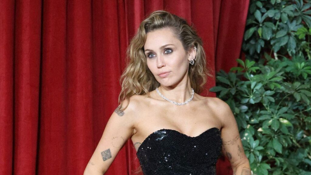 Image of Miley Cyrus reflected on her career reinvention while embracing earlier days.